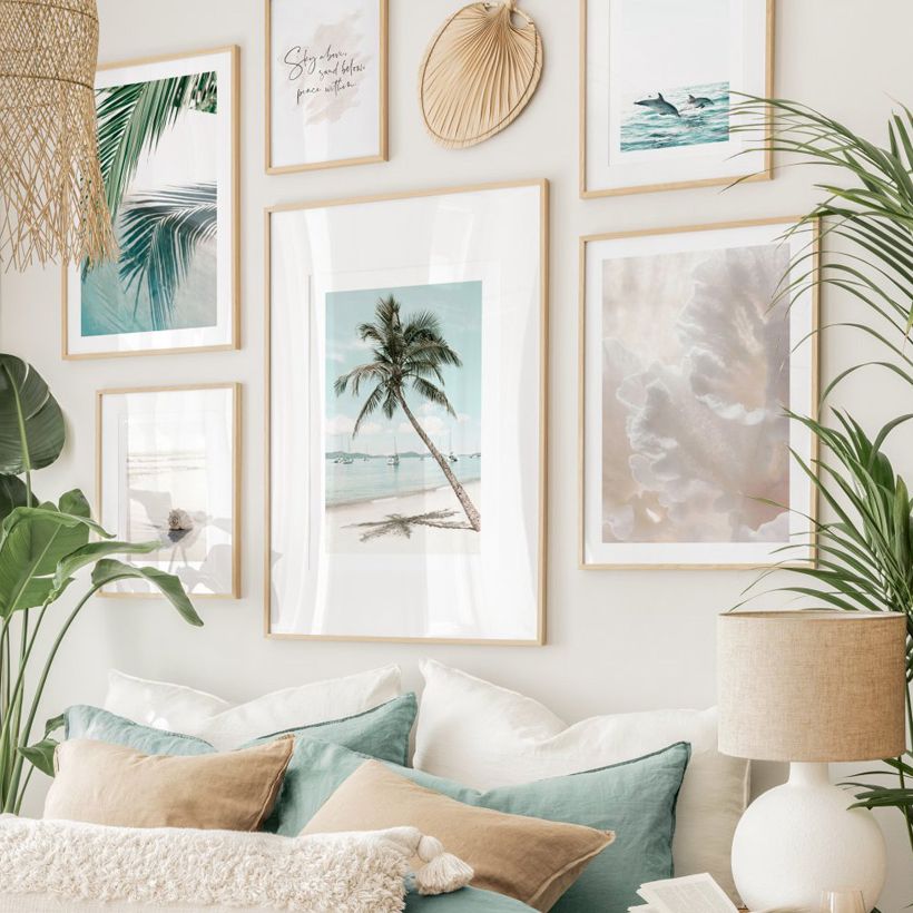 Beach wall art on beige wall.