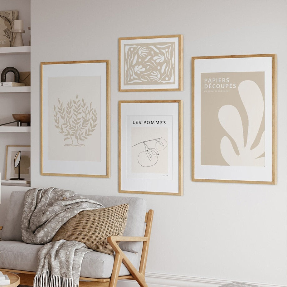 Beige canvas wall art set on living room wall.