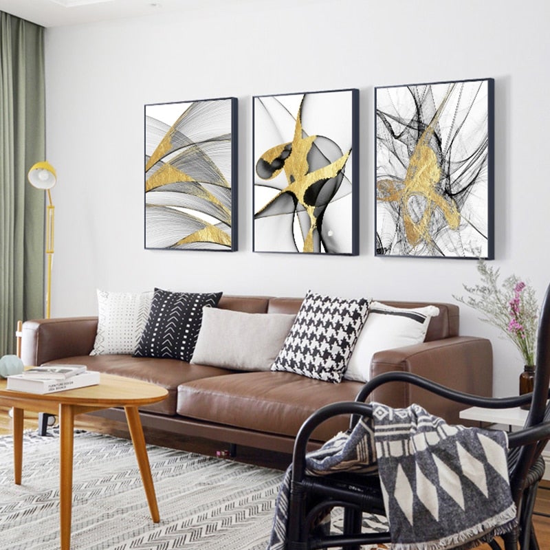 Black White & Gold Abstract Wall Art set on living room wall.