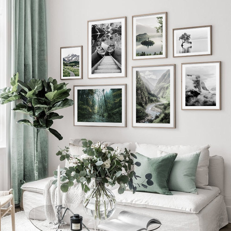 Green and black nature wall art set in living room.