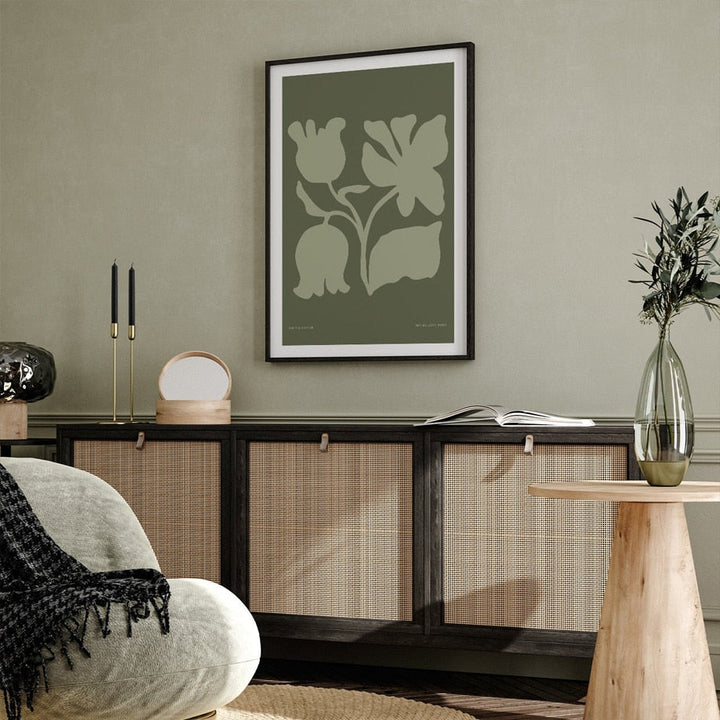 Abstract green canvas print on green living room wall.