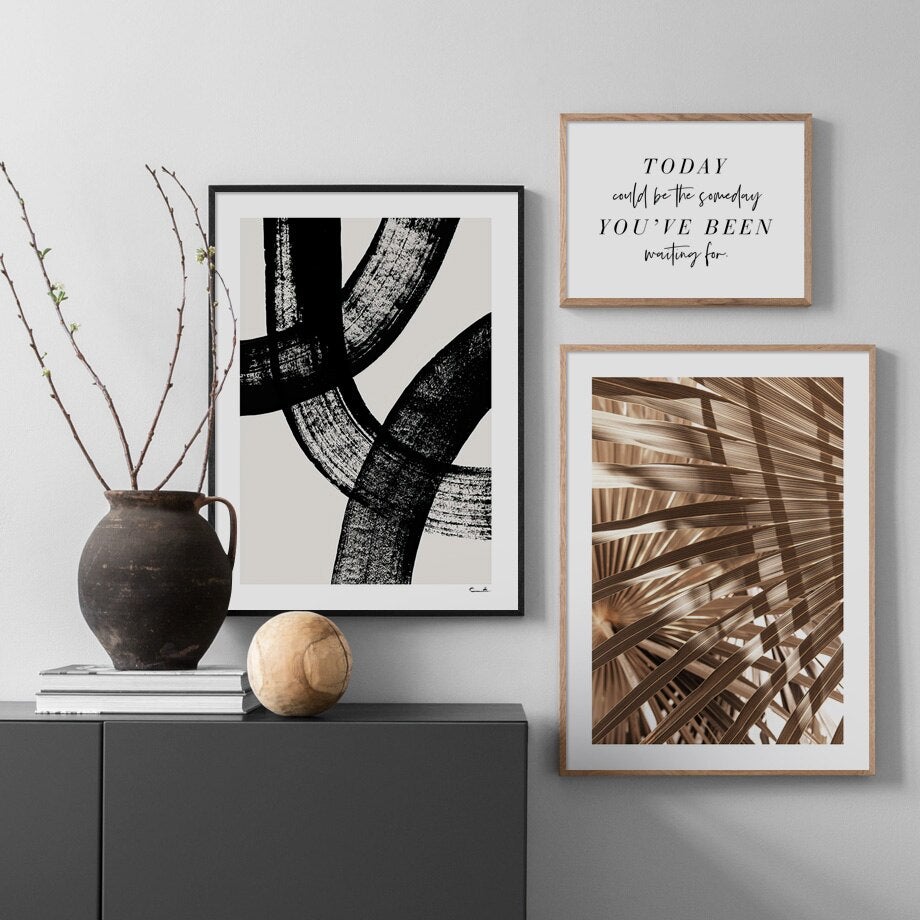 3 piece gallery on wall above sideboard.