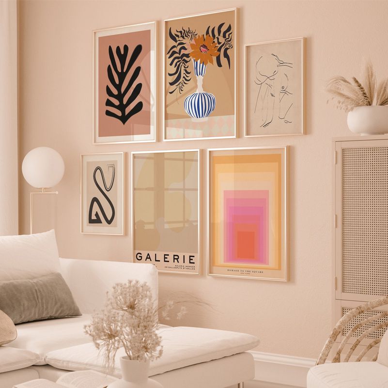 Beige gallery set on beige living room wall.