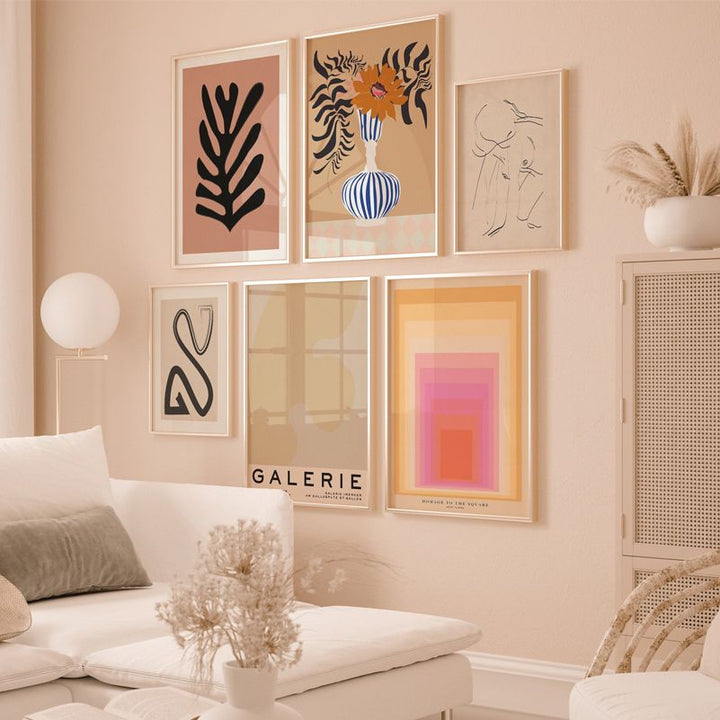 Beige gallery set on beige living room wall.