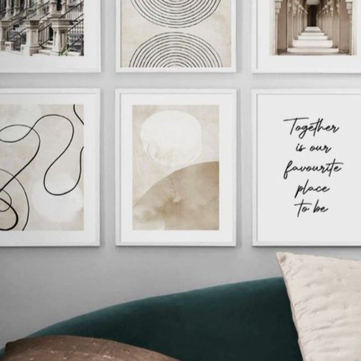 Beige neutral wall art set on wall.