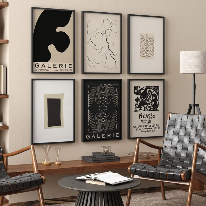 Black abstract wall art set on lounge wall.