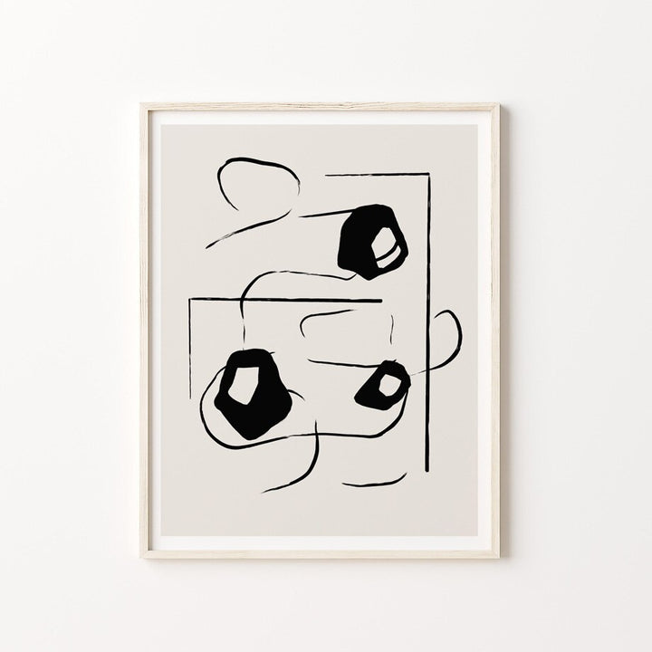 Black and beige abstract poster in frame.