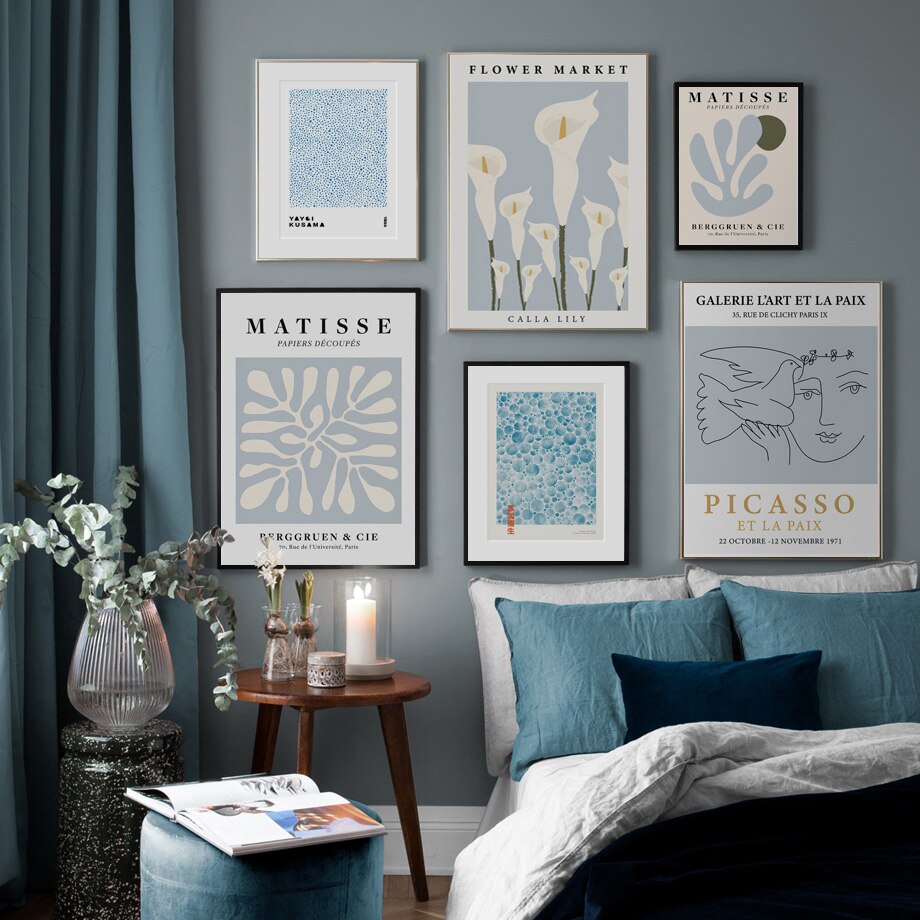 Blue abstract gallery set on blue living room wall.