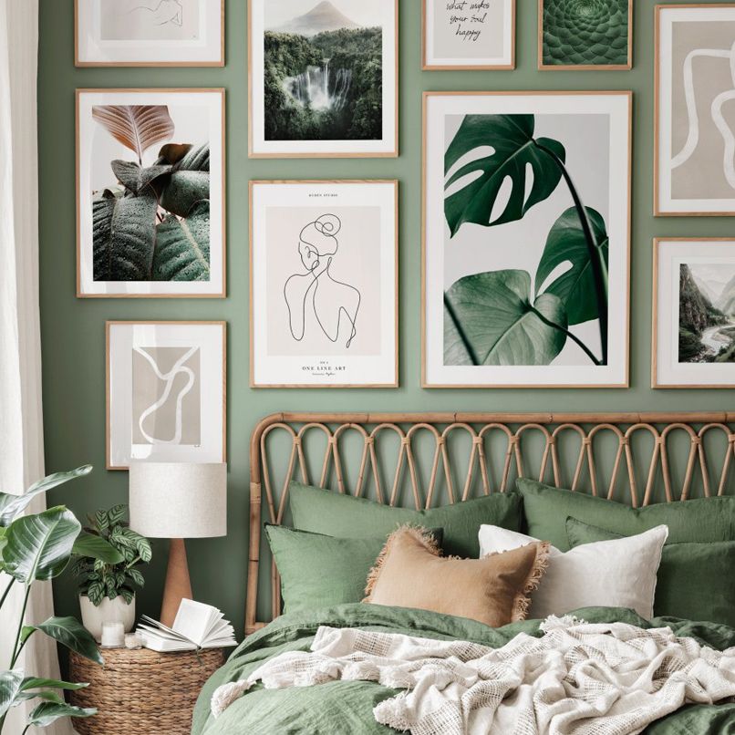 Green nature wall art set on green bedroom wall.