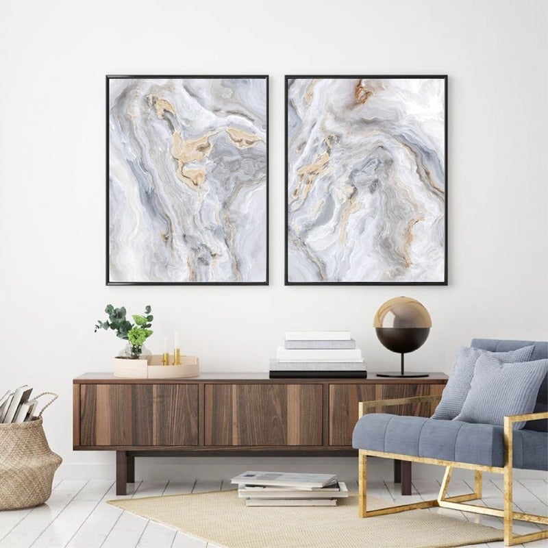 Grey and gold abstract wall art set on white wall.