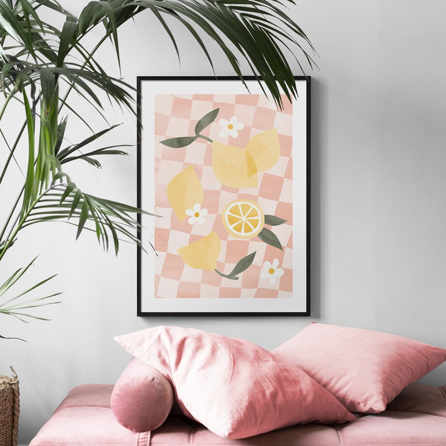 Lemons on a blacket painting poster on wall above lounge seat.