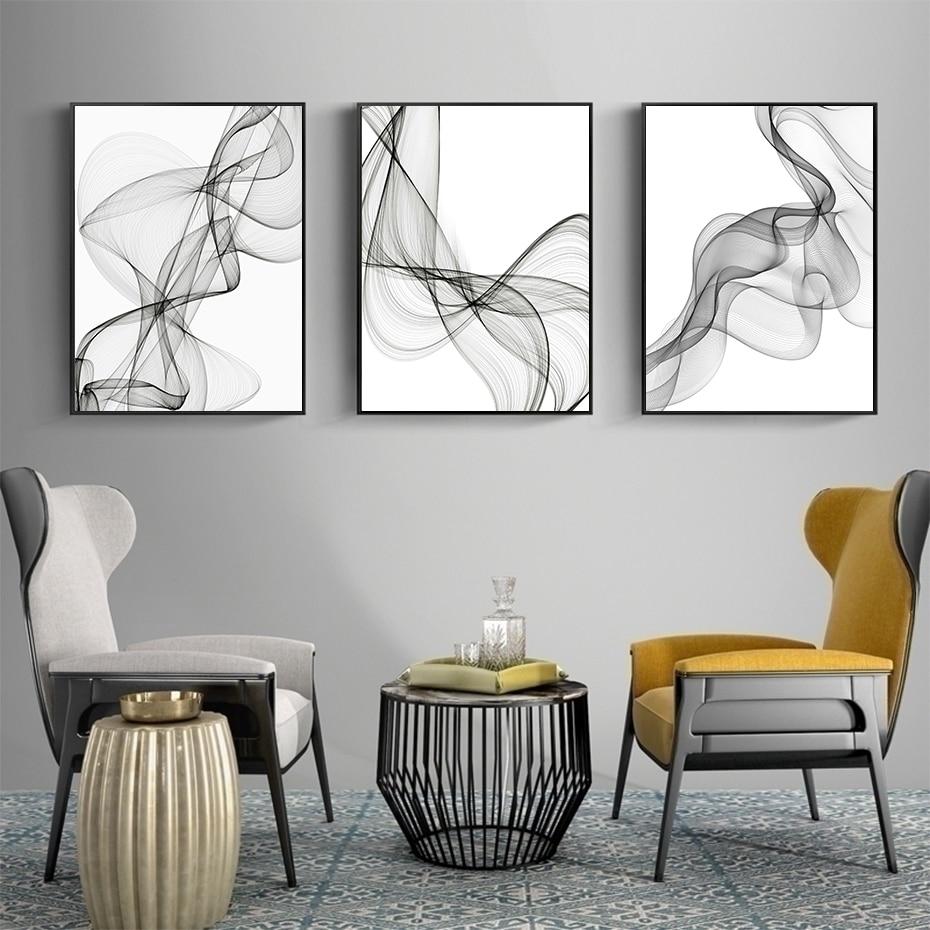 3 piece minimalist canvas gallery on grey living room wall.