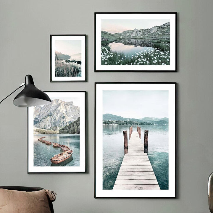 4 piece nature prints on green wall.