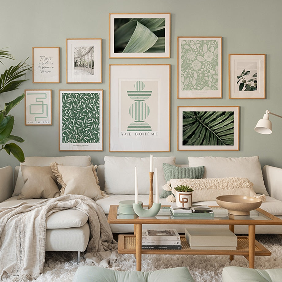 Sage green wall art set on living room wall.