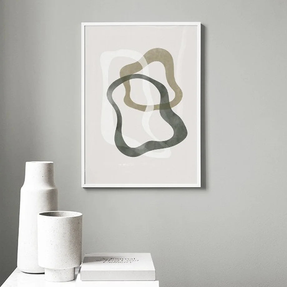 Abstract olive green canvas print on grey wall.