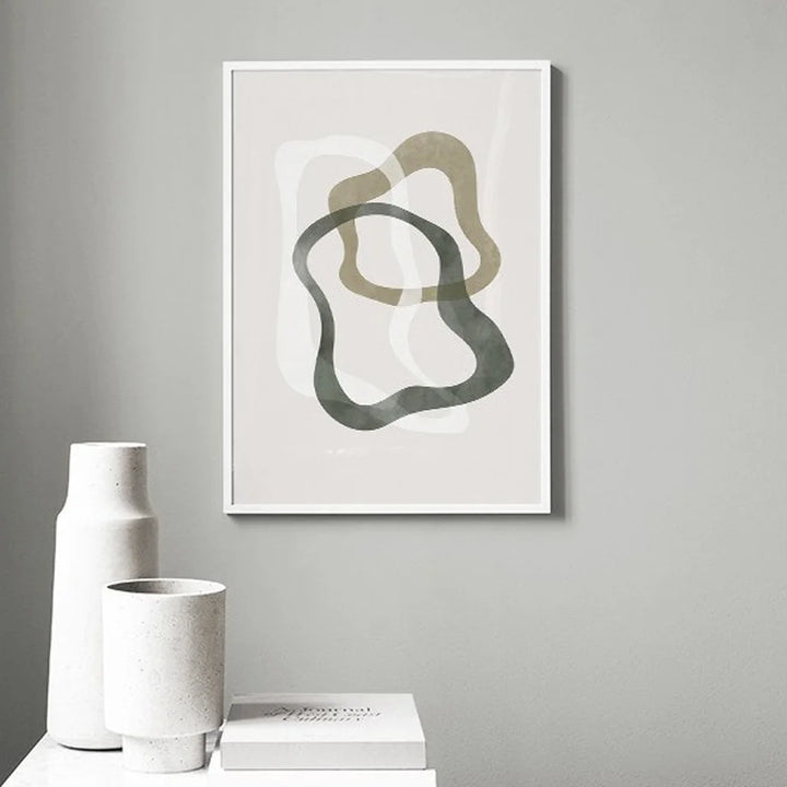 Abstract olive green canvas print on grey wall.