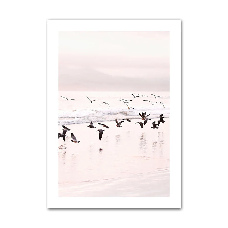 Canvas print with birds flying over water at sunset.