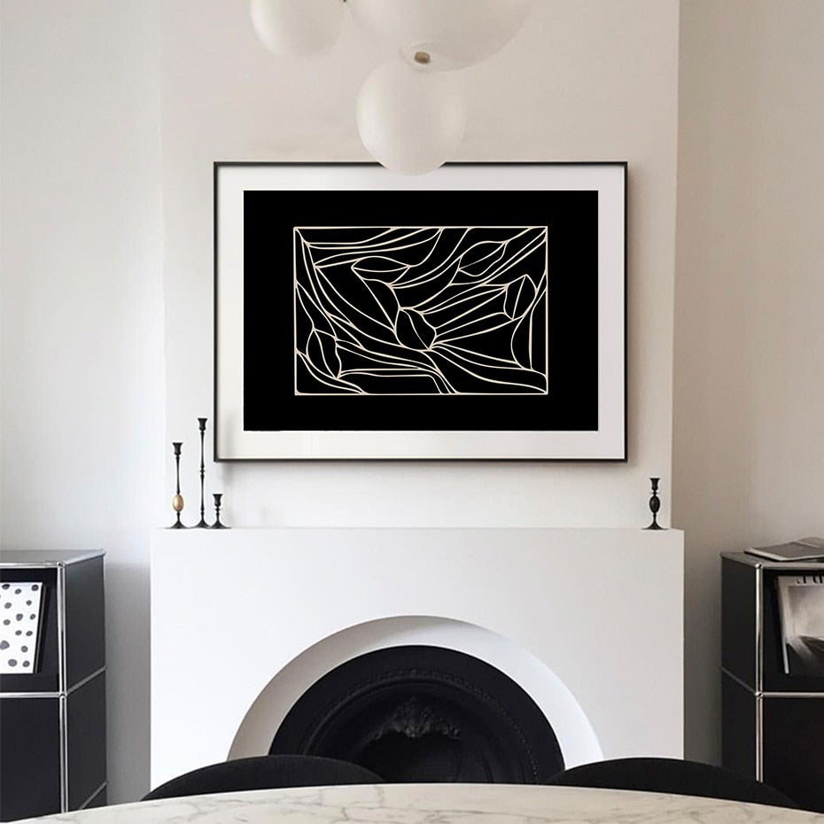 Black abstract canvas poster on wall above fireplace.