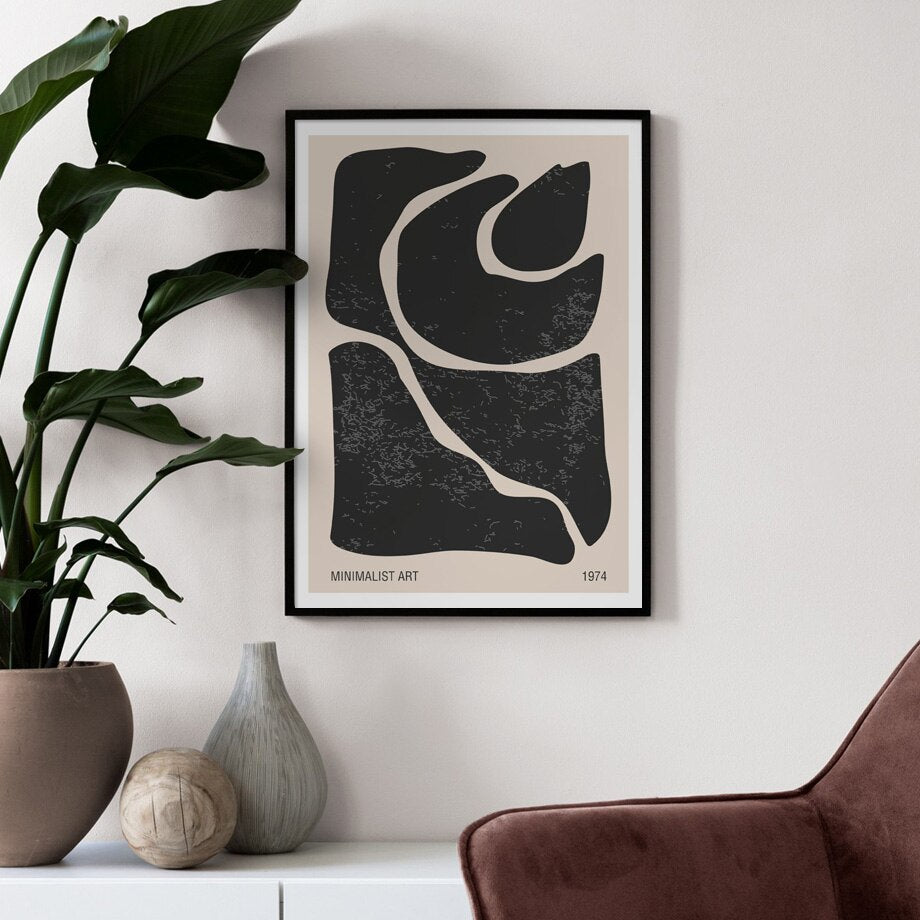 Black and beige abstract poster on wall.
