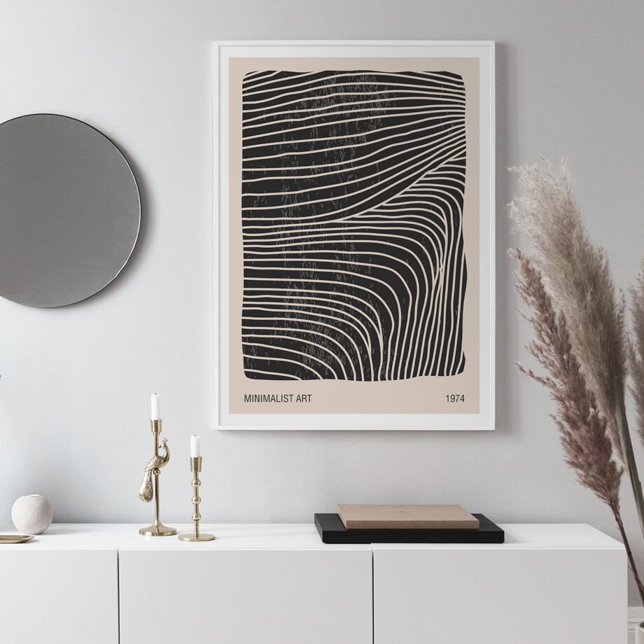 Black and beige wall art prints on wall.