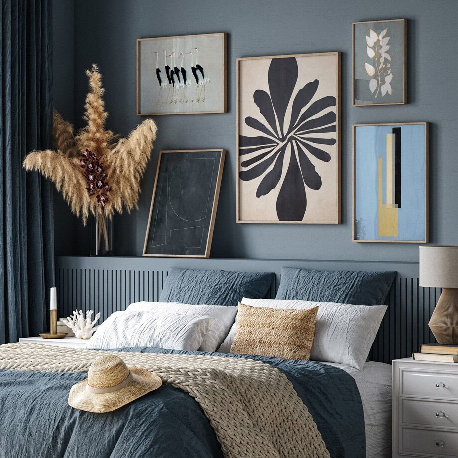 Blue abstract wall art set in bedroom.