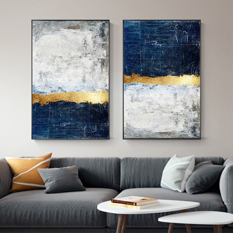 Blue and gold wall art set on wall.