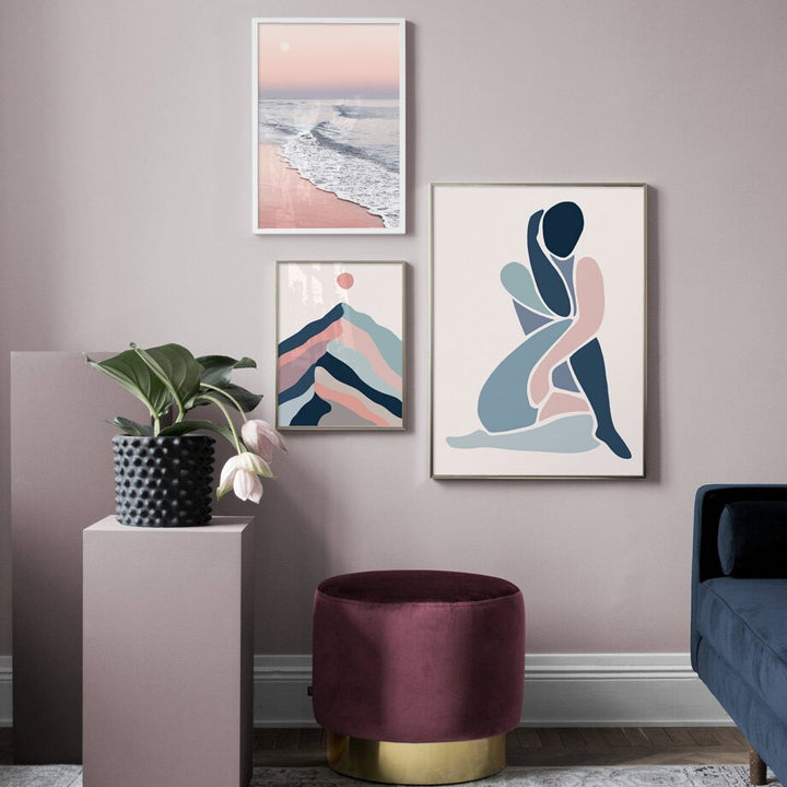 Blue and pink abstract wall art set on wall.