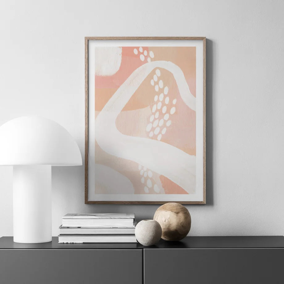 Abstract peach wave with dotted pattern canvas print on living room wall.