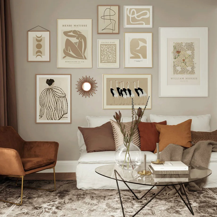 Fawn and cream wall art on beige living room wall above sofa.