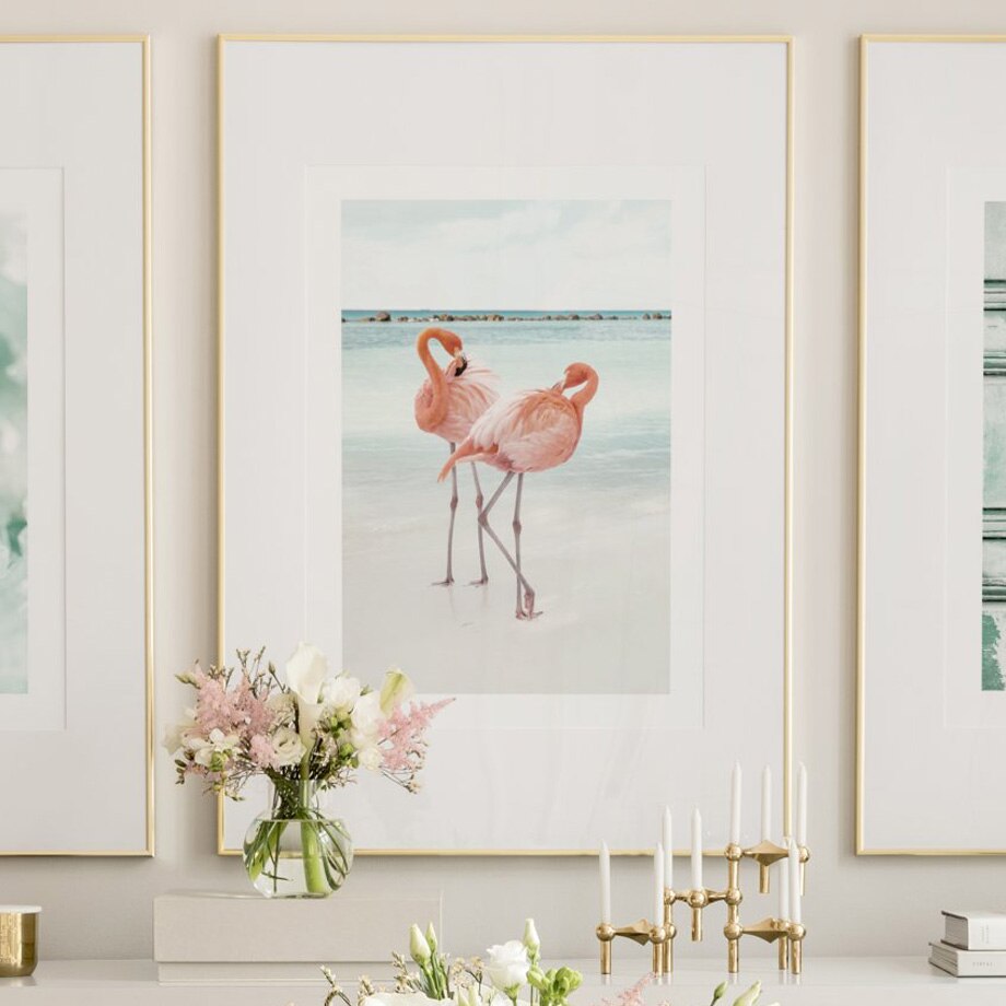 Flamingo canvas poster on desk.