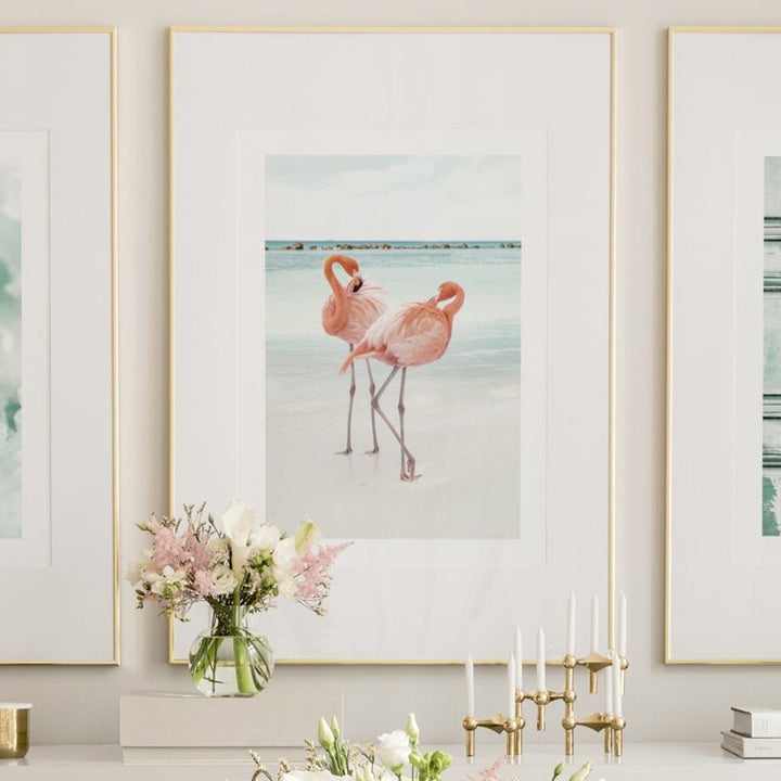 Flamingo canvas poster on desk.