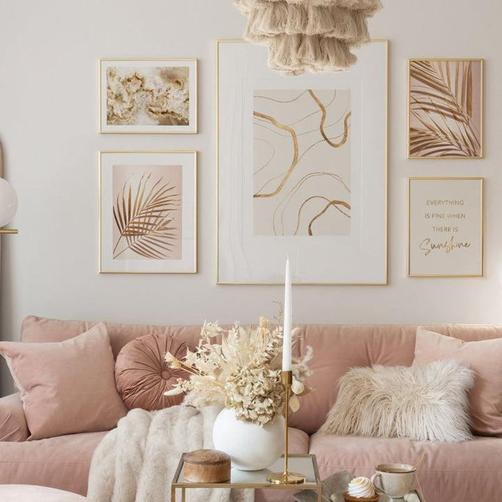 Gold abstract wall art set in living room.