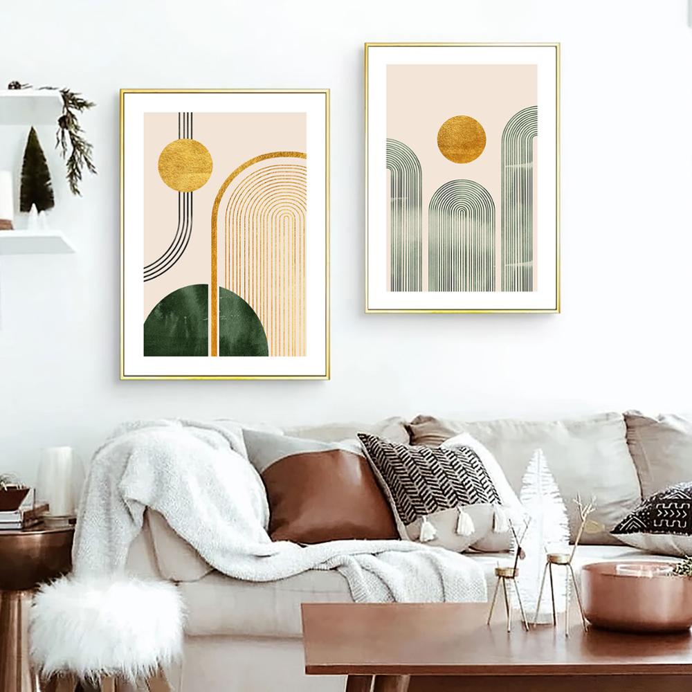Gold white and grey wall art on white living room wall.