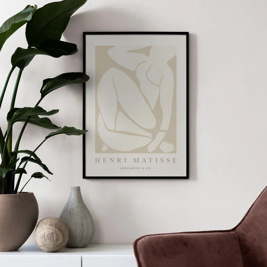Cala canvas print in black frame styled with houseplant