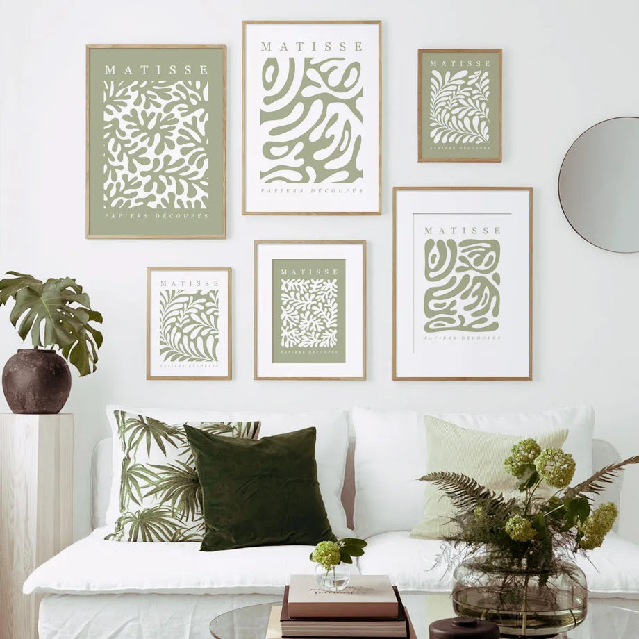 Living room with a white sofa, decorative pillows, and wall art featuring the name 'Matisse'.