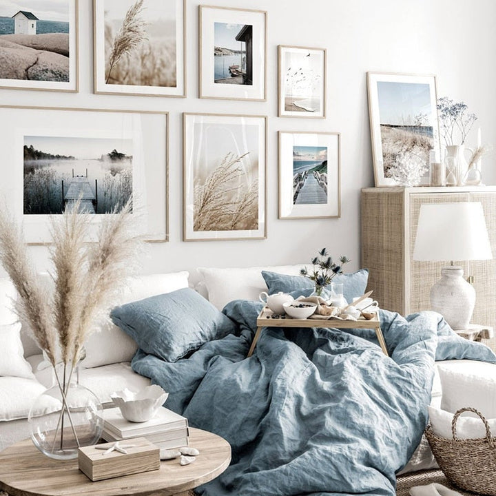 Coastal pictures wall art set on white wall.