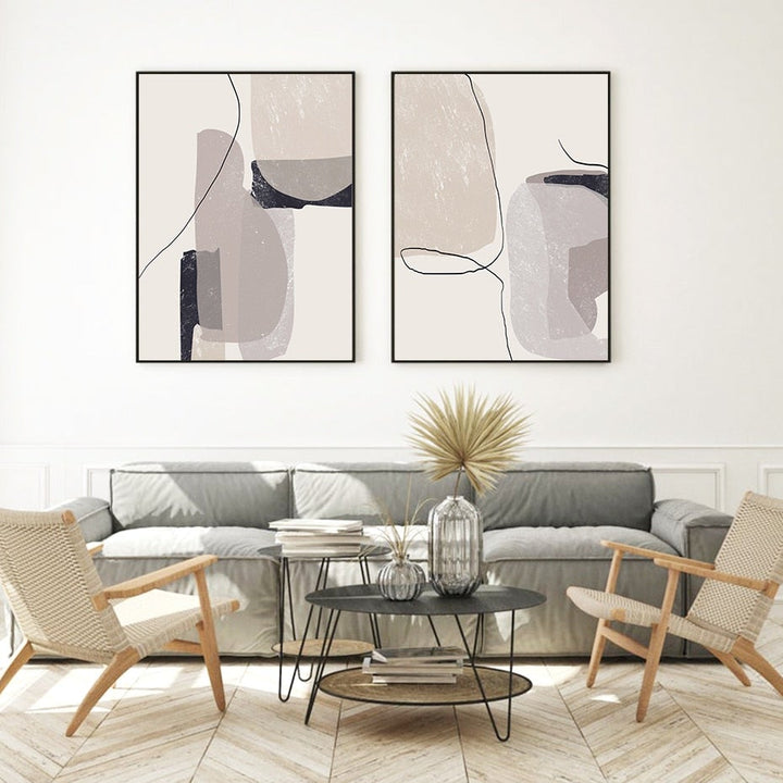 2 Neutral abstract wall art set on living room wall.