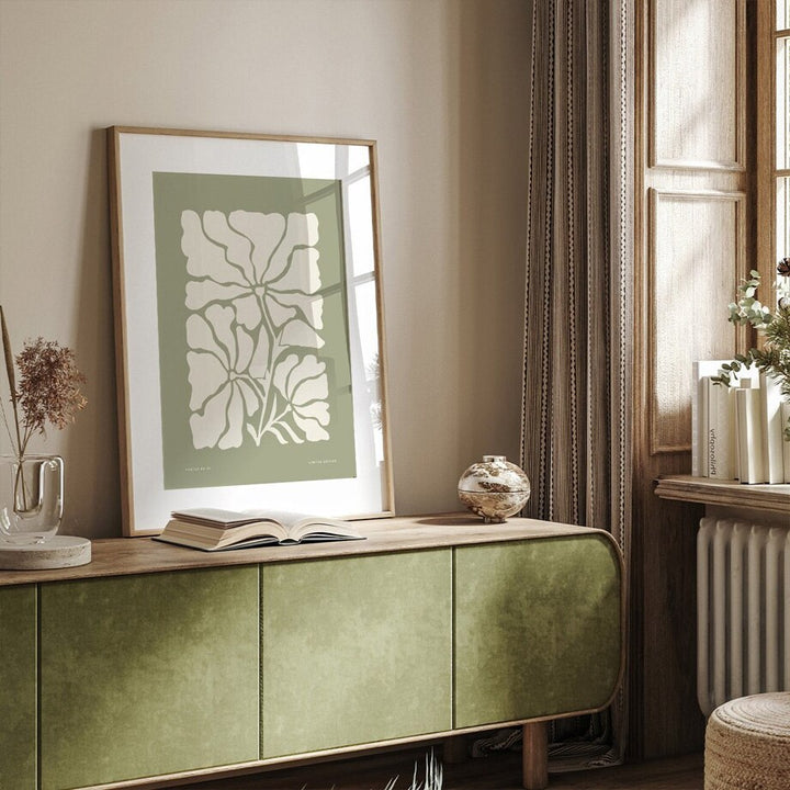 Olive green canvas poster on sideboard.