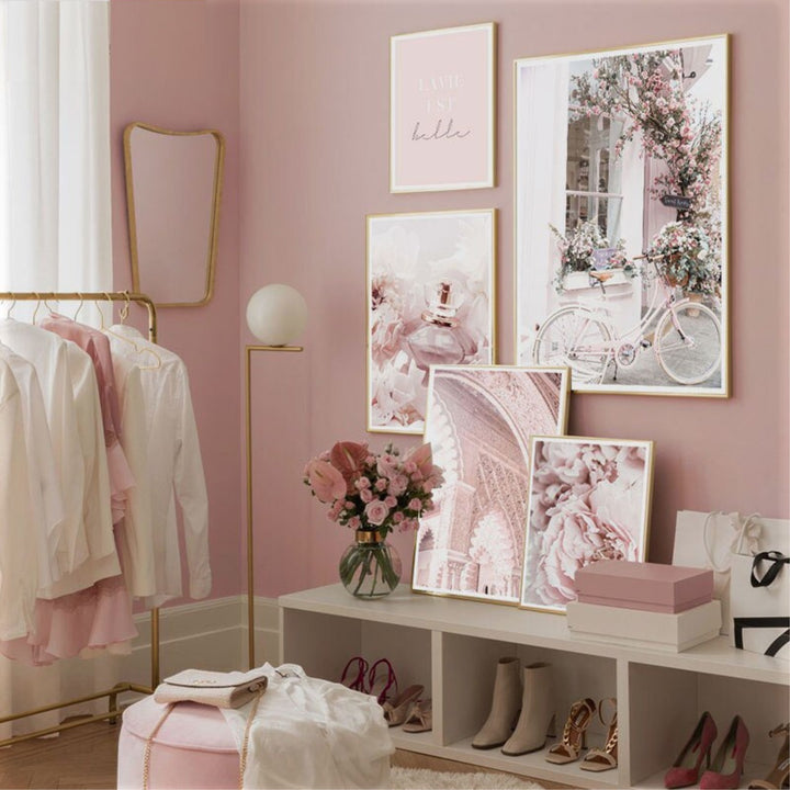 Pink wall art set in bedroom.