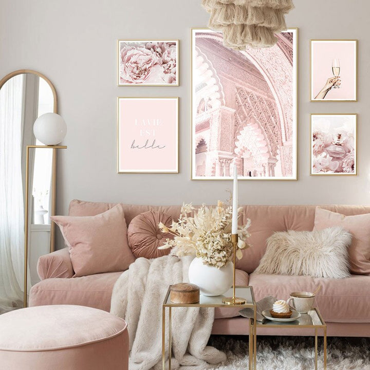 Pink wall art set in living room.