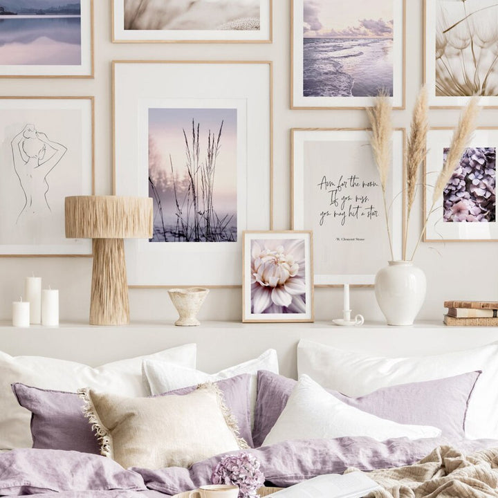 Purple wall art set in bedroom.