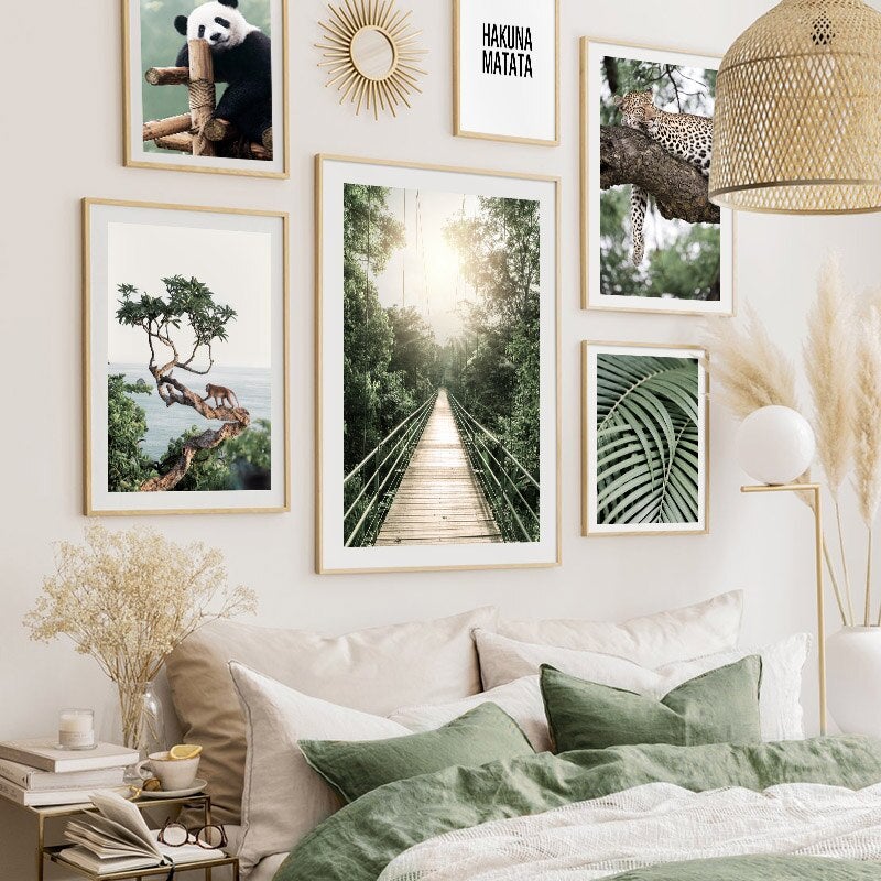 Jungle wall art set on wall above bed.