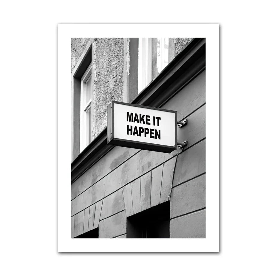 Black and white canvas print of a street sign saying 'make it happen'.