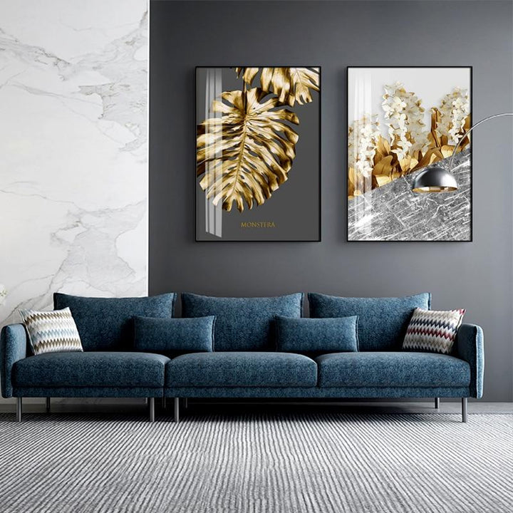 Gold and grey wall art set on wall.