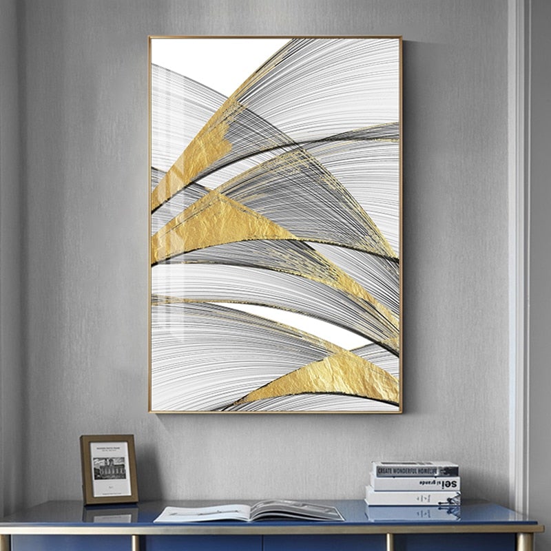 Gold and black abstract canvas poster on grey wall.