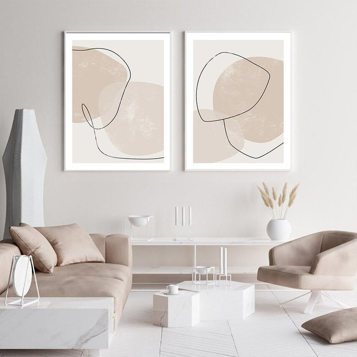 2 piece abstract beige prints on living room wall.