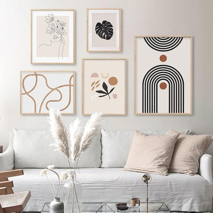 5 piece abstract canvas poster gallery on living room wall.