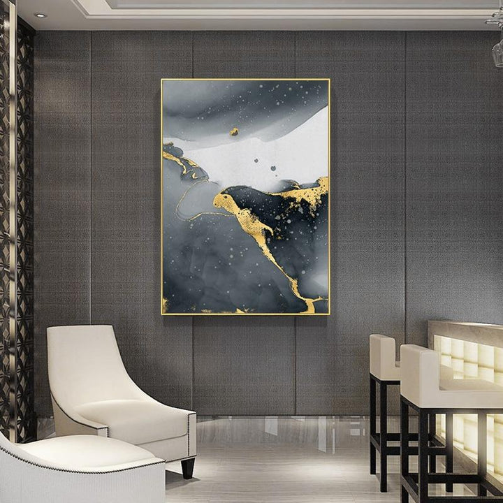 Black white and gold canvas poster on wall.