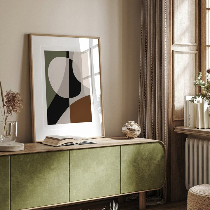 Brown and green abstract poster on sideboard.
