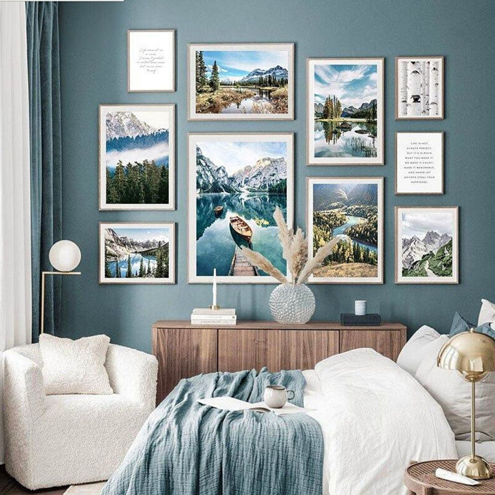 Forest lake photography gallery set on green bedroom wall above sideboard.